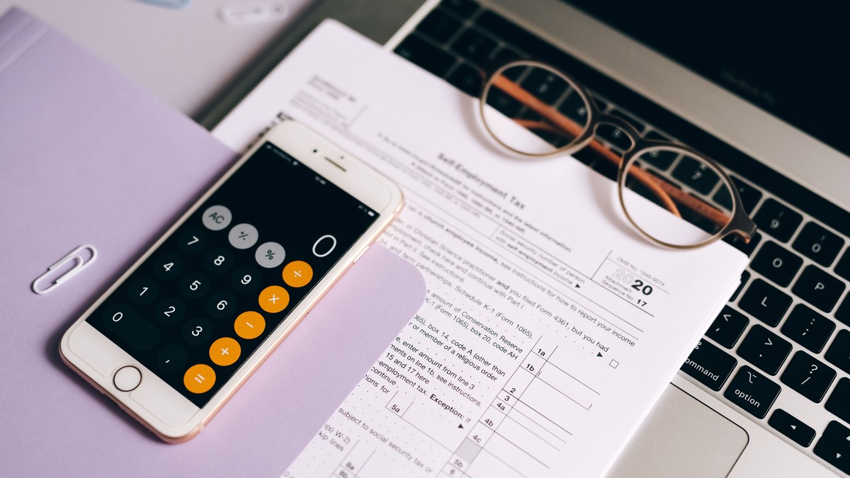 Smartphone calculator app over a tax document