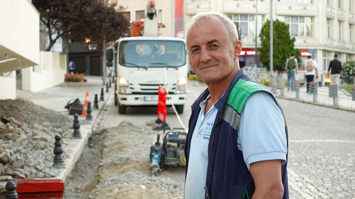 Construction worker smiling at a worksite
