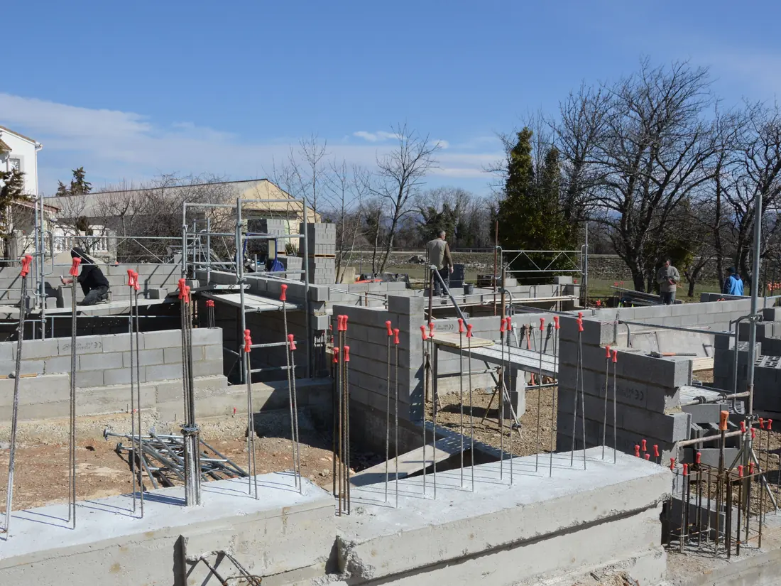 Builders framing block work on a construction site